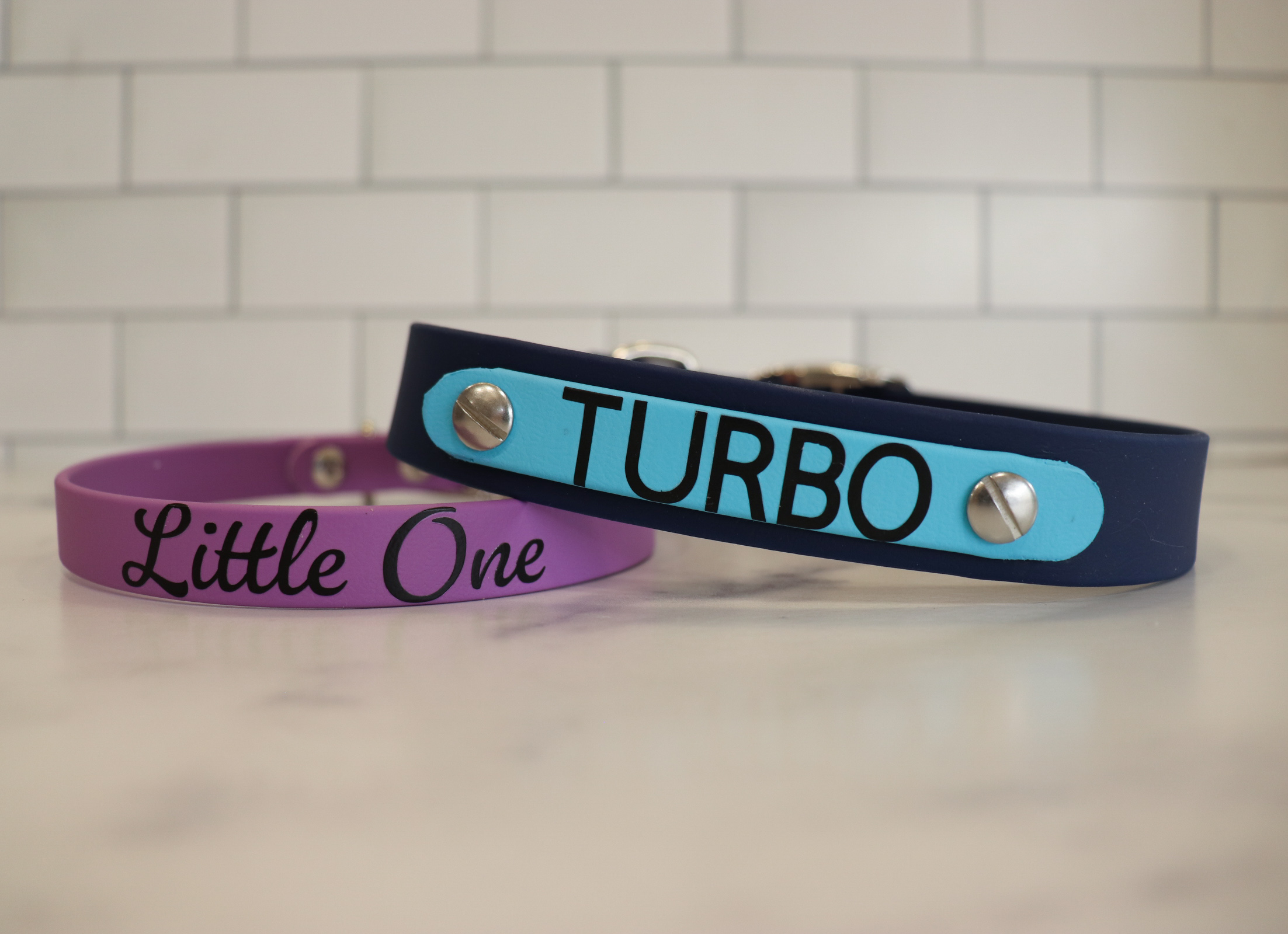 Item: Custom collar designs | Widths: 5/8 in & 1 in | Colors: Amethyst Purple & Deep Sea base | Hardware: silver | Custom: Examples of widths and color layouts